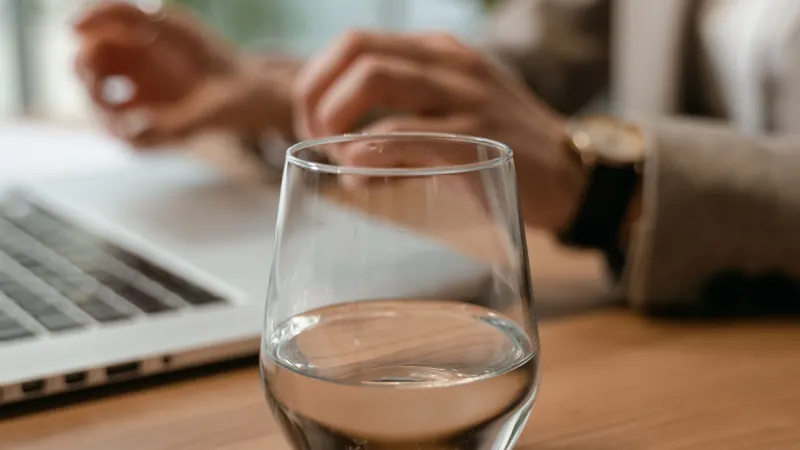 A glass of water on a wooden table